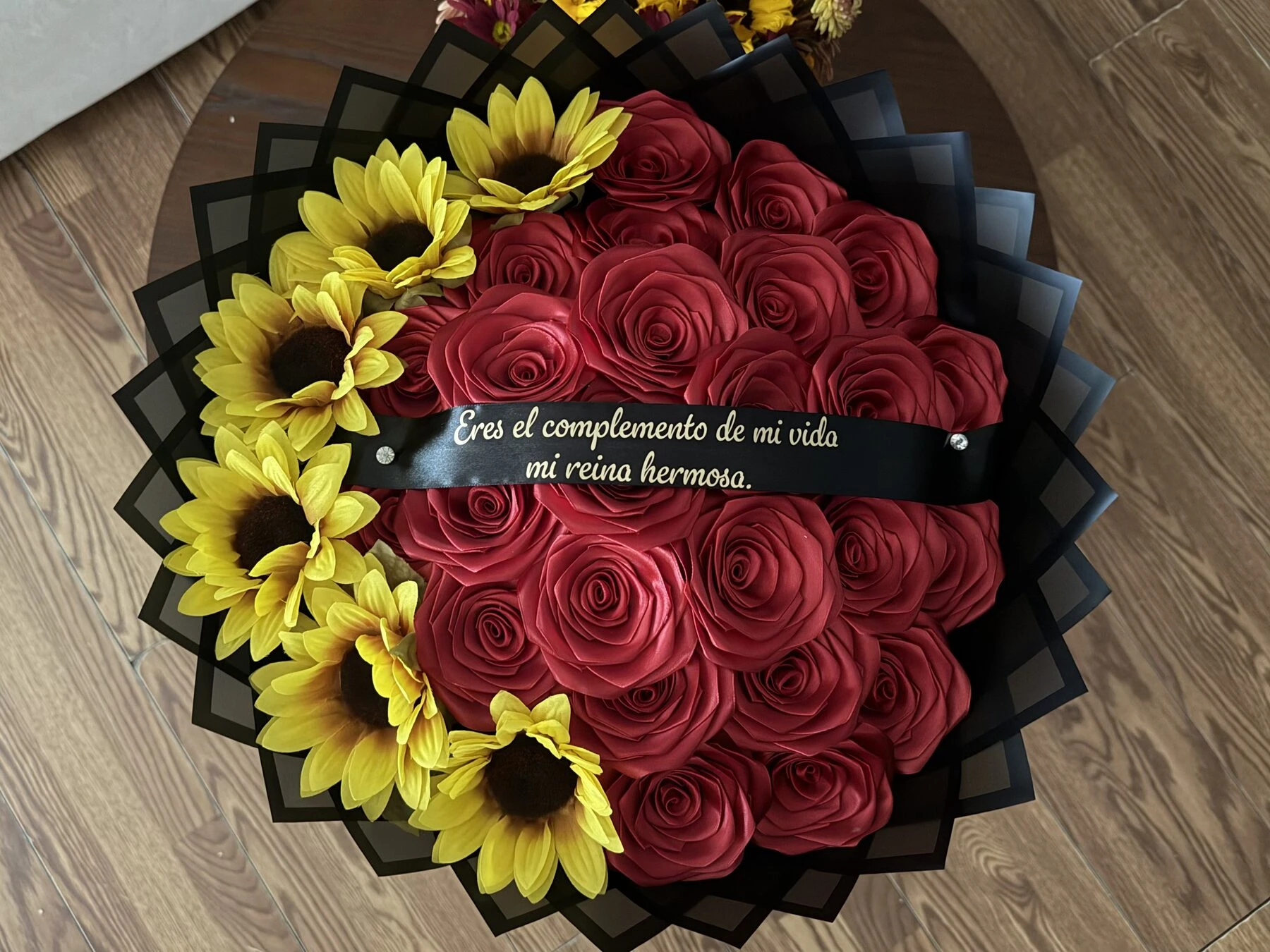 A close view of red and yellow blooms arranged in a round shape.