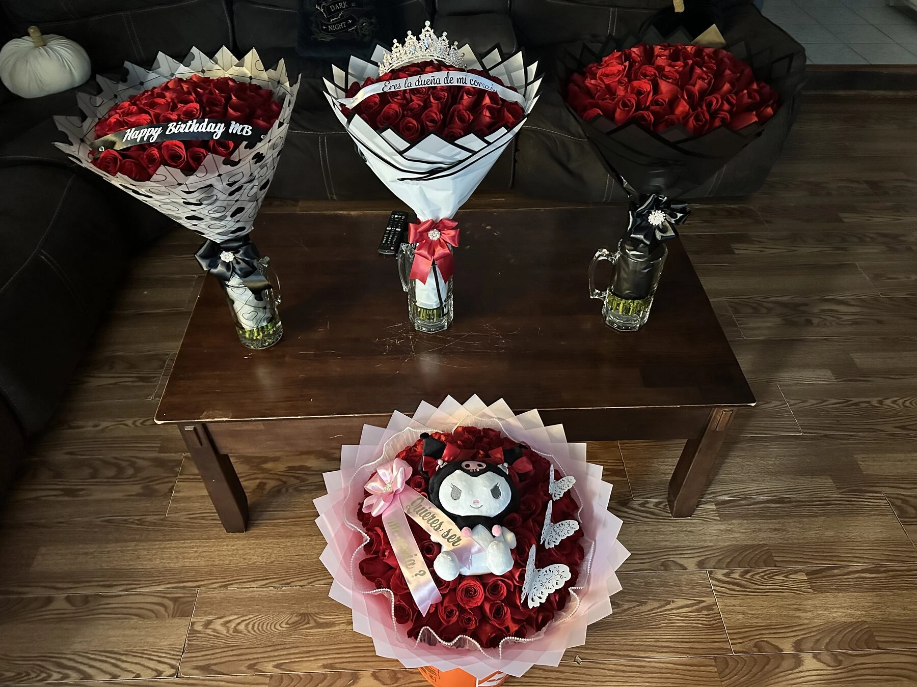 Several small floral arrangements and a round gift arrangement displayed together.