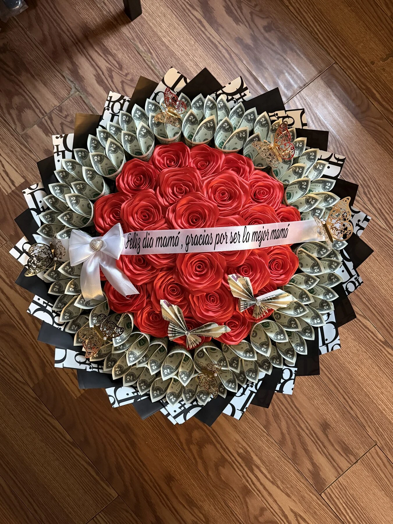 Red flowers with folded bills and black-and-white wrapping.